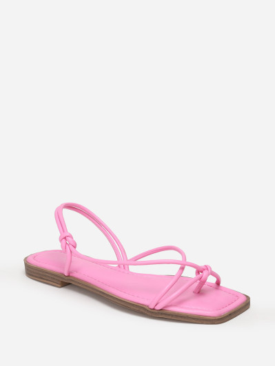 Sandales plates roses à fines brides nouées