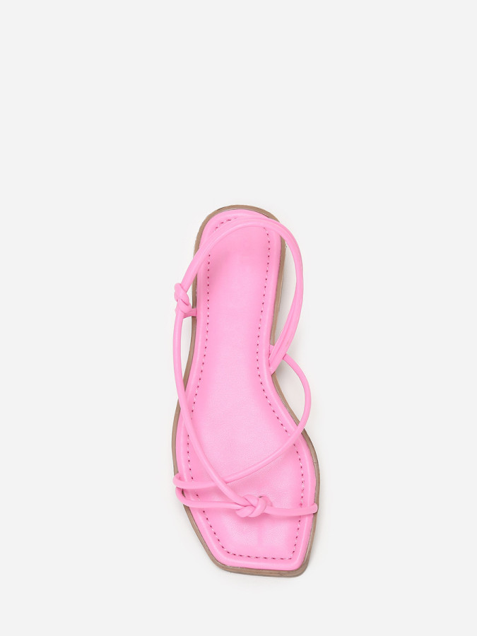 Sandales plates roses à fines brides nouées