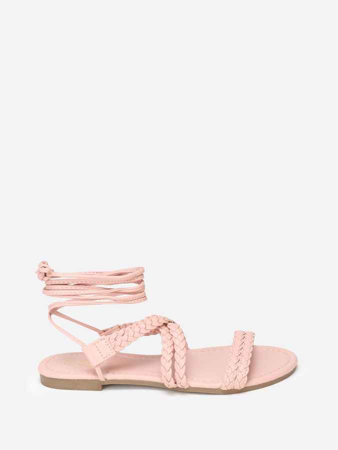 Sandales plates roses à fines brides tressées