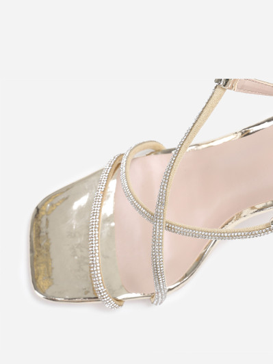 Sandales dorées à talon fin transparent et strass