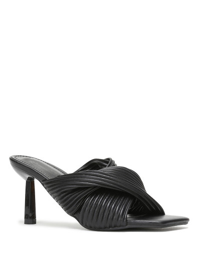 Mules noires à talon aiguille et brides croisées