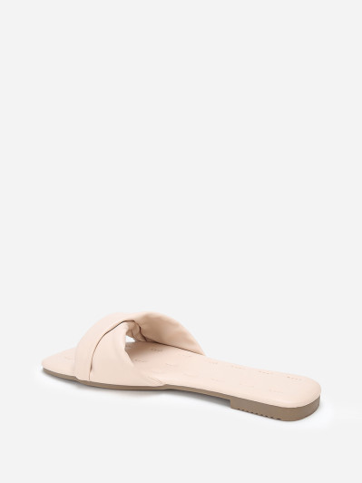 Mules plates beiges à bride torsadée en simili