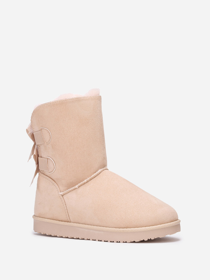 Boots fourrées en suédine à rubans