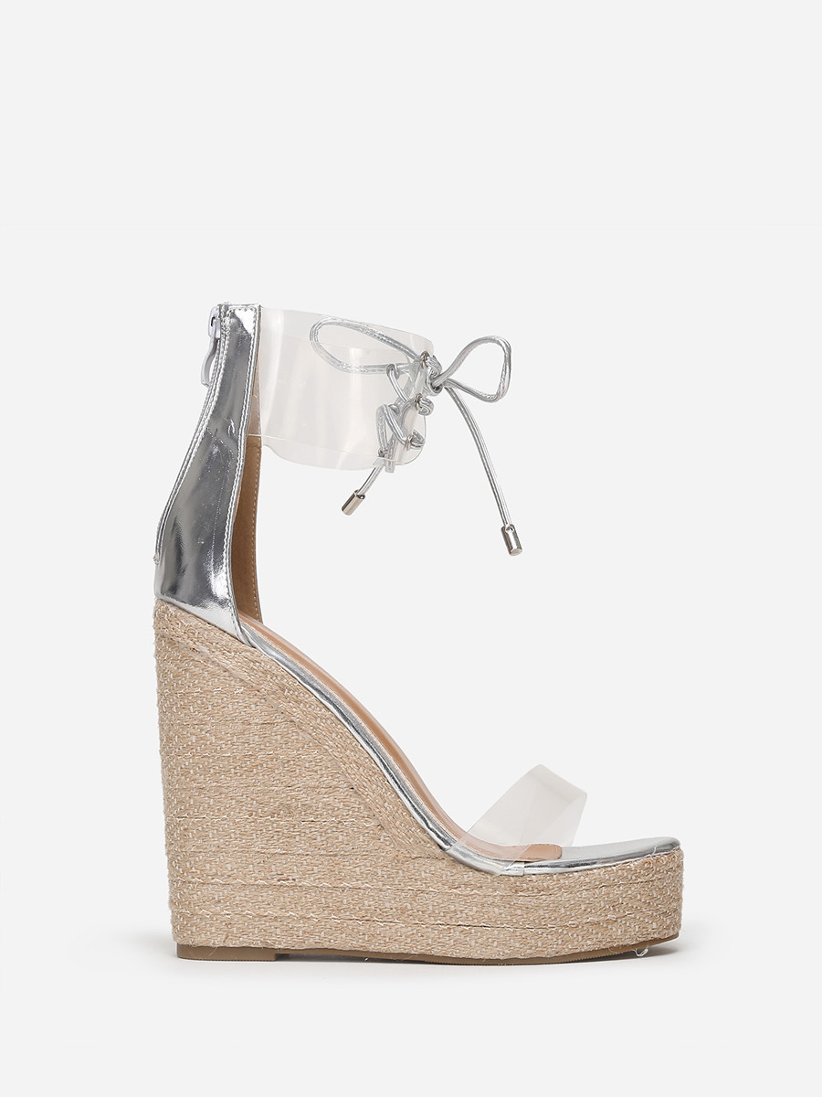 Sandales compensées argentées à brides transparentes
