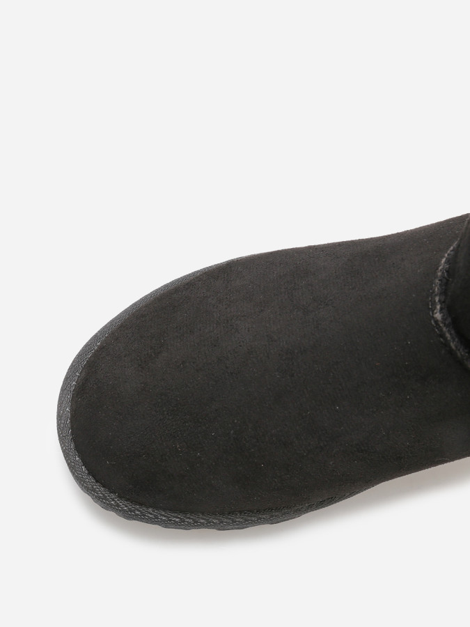 Boots en suédine fourrées à ruban noué