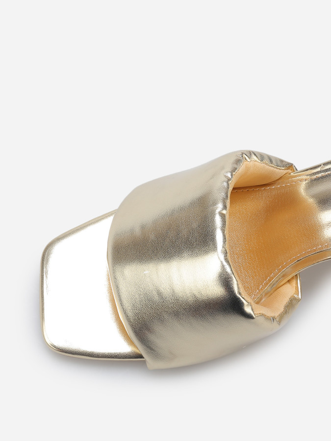 Mules à talon et bride rembourrée