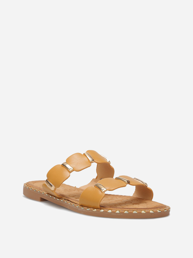 Mules à brides festonnées et détails dorés