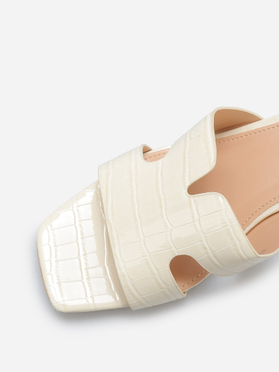 Mules ajourées à talon carré