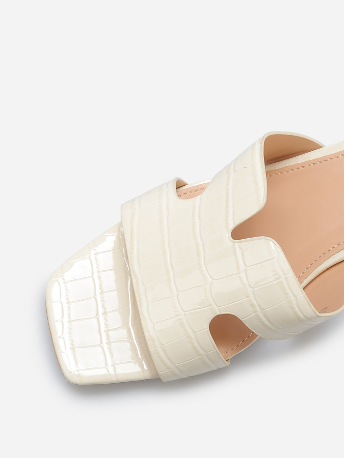 Mules ajourées à talon carré