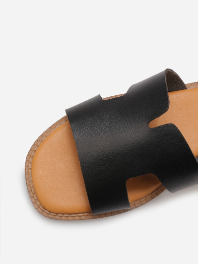 Mules compensées à bride ajourée