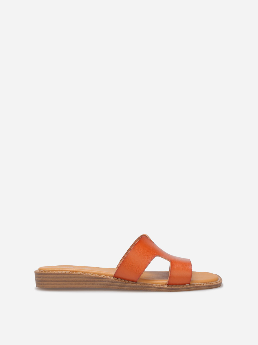 Mules compensées à bride ajourée