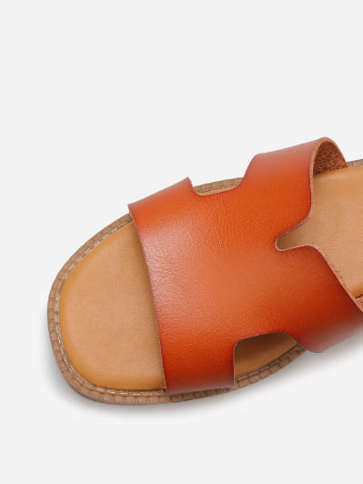 Mules compensées à bride ajourée