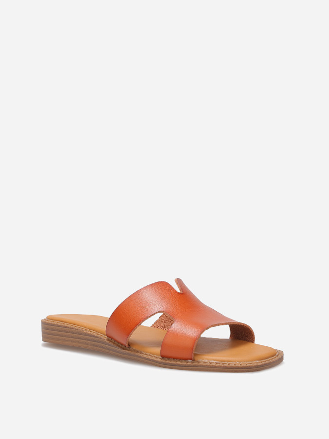 Mules compensées à bride ajourée