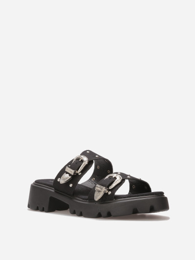 Mules à boucles et clous argentés