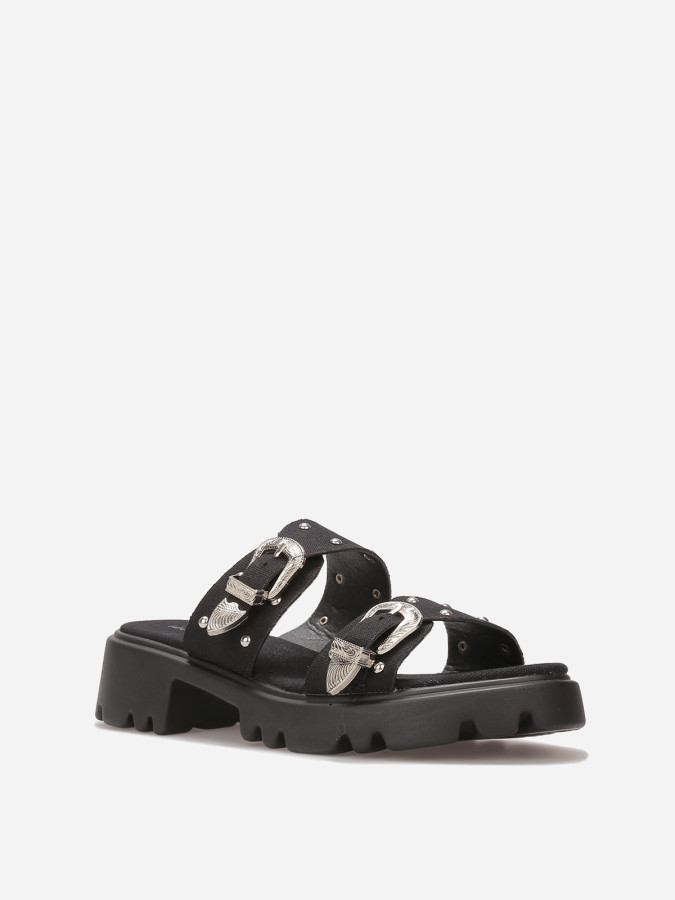 Mules à boucles et clous argentés