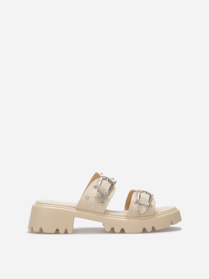 Mules à boucles et clous argentés