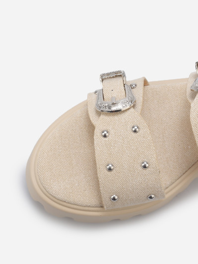 Mules à boucles et clous argentés