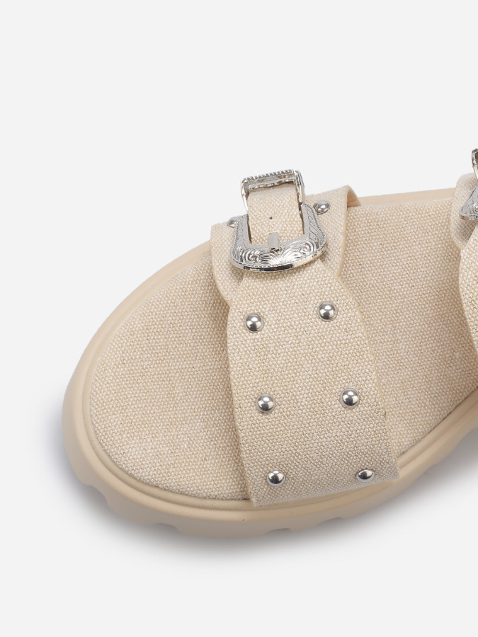 Mules à boucles et clous argentés