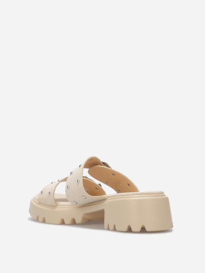 Mules à boucles et clous argentés