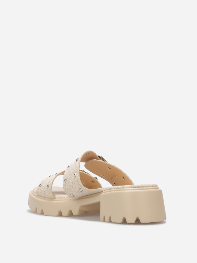 Mules à boucles et clous argentés