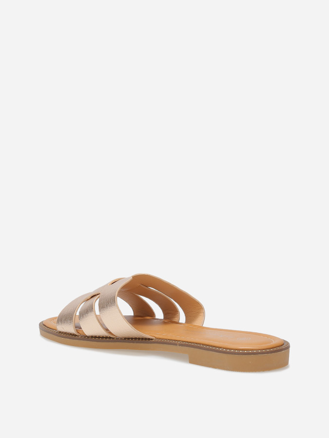 Mules plates à brides texturées et entrecroisées