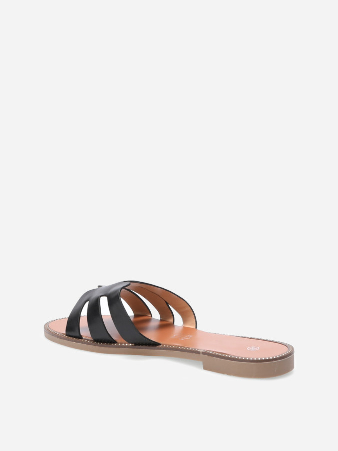 Mules plates à bride ajourée et clous