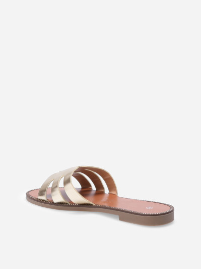 Mules plates à bride ajourée et clous