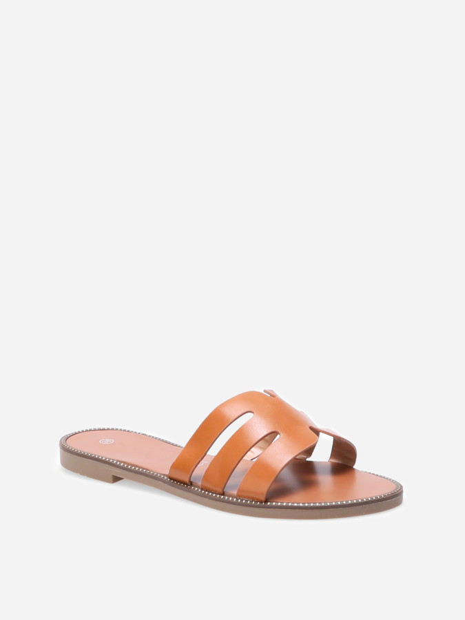 Mules plates à bride ajourée et clous