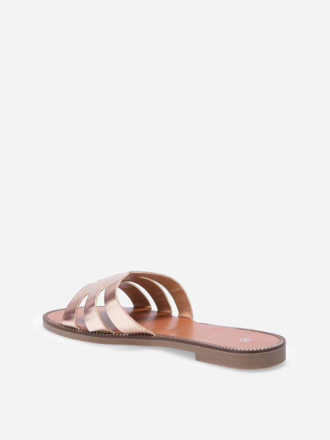 Mules plates à bride ajourée et clous