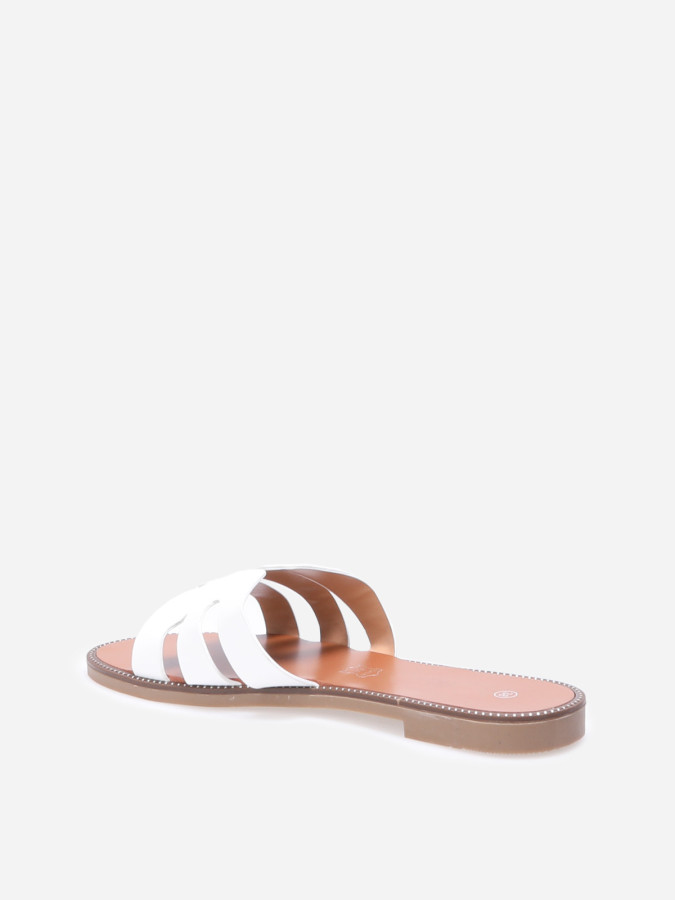 Mules plates à bride ajourée et clous