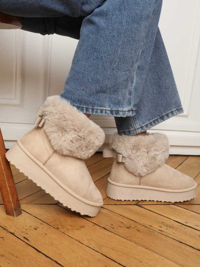 Boots fourrées à plateforme et nœud