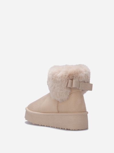 Boots fourrées à plateforme et nœud