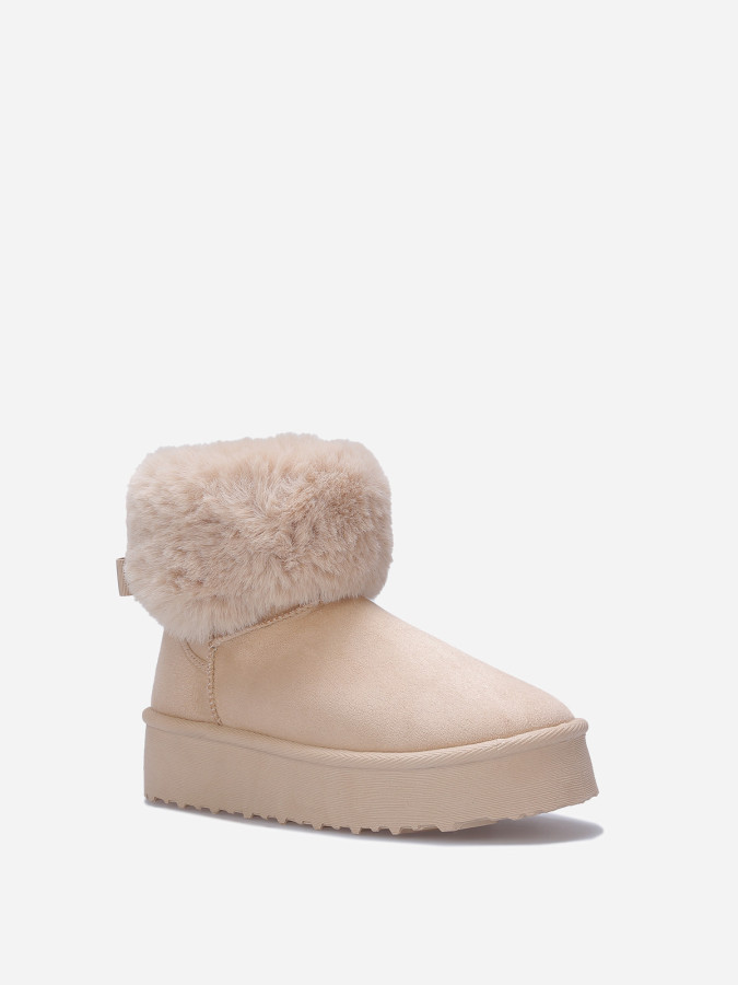 Boots fourrées à plateforme et nœud