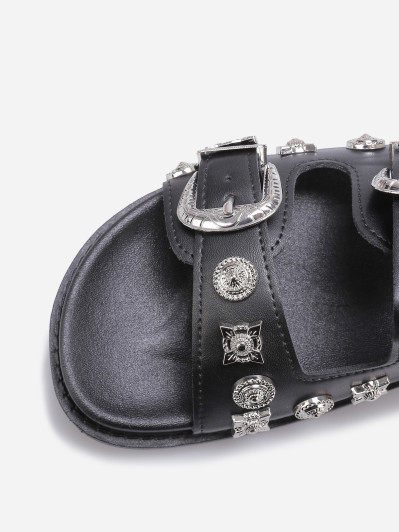 Mules à boucles et bijoux noires