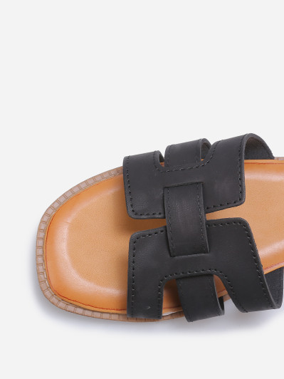 Mules plates à brides entrecroisées noires