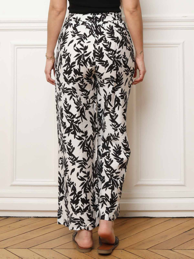Pantalon ceinturé noir à motifs feuilles