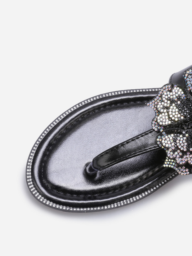 Sandales noires avec détail papillon à strass