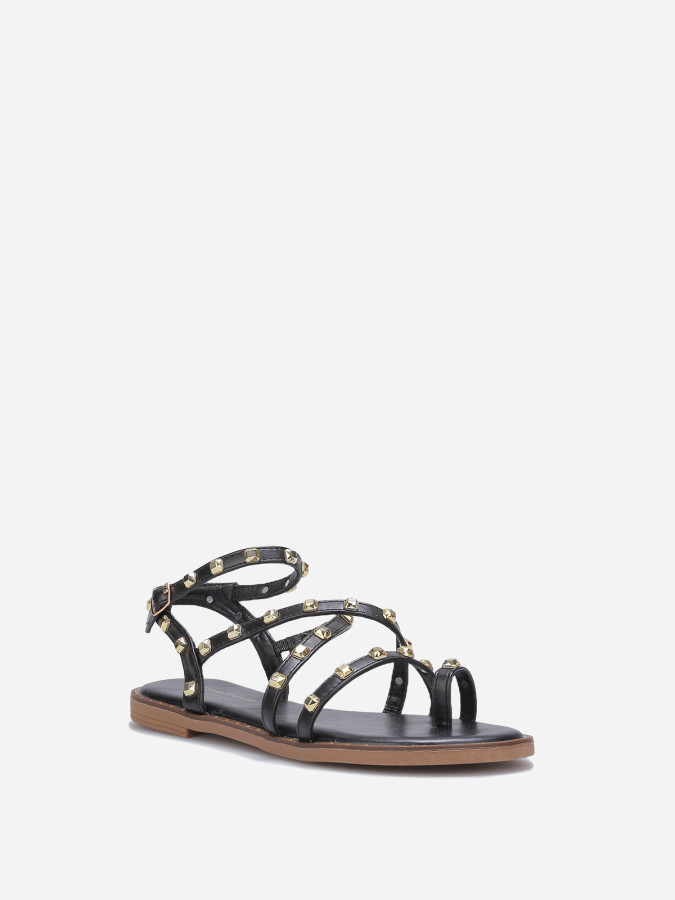 Sandales noires plates à clous dorés