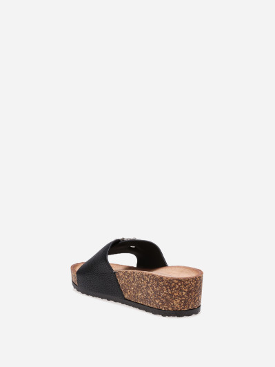 Mules compensées noires avec boucle à strass