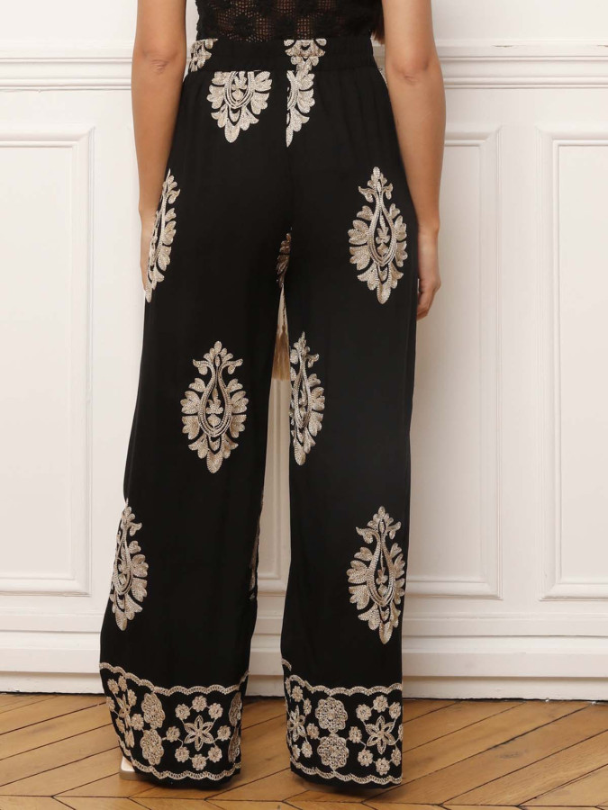Pantalon noir à motifs baroques brodés