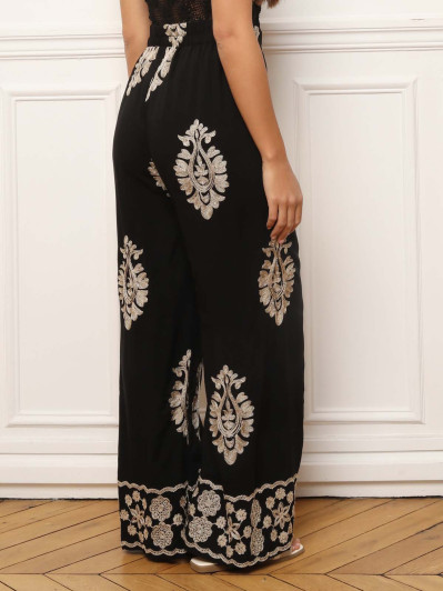 Pantalon noir à motifs baroques brodés