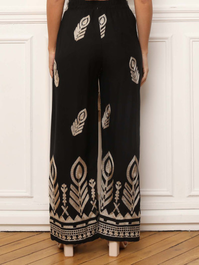 Pantalon ample noir à motifs brodés dorés