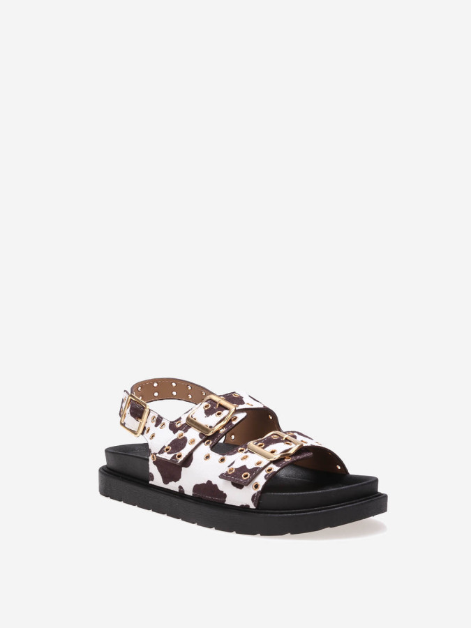 Sandales motif vache à boucles et œillets métalliques