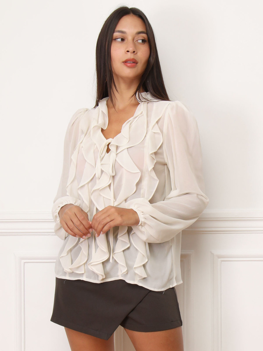 Blouse beige à volants et manches bouffantes