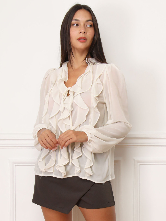 Blouse beige à volants et manches bouffantes