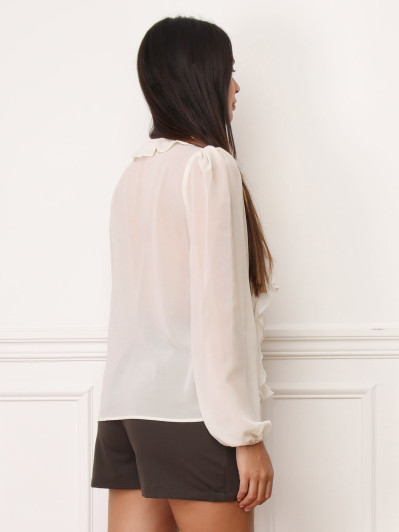 Blouse beige à volants et manches bouffantes
