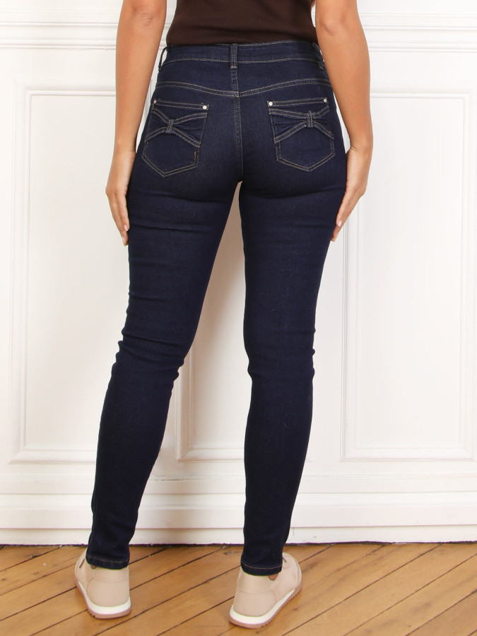 Jeans skinny bleu froncé avec noeuds décoratifs