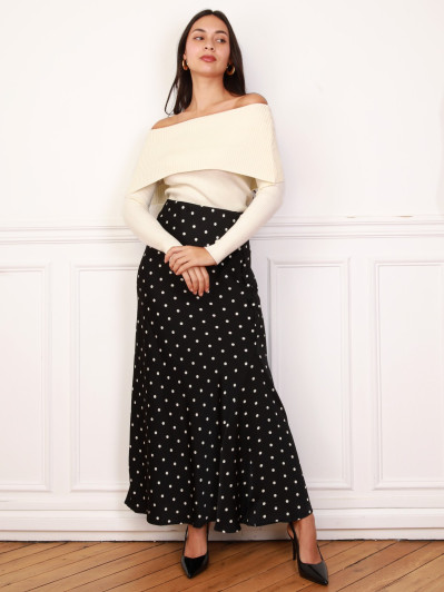 Jupe noire satinée à motifs pois