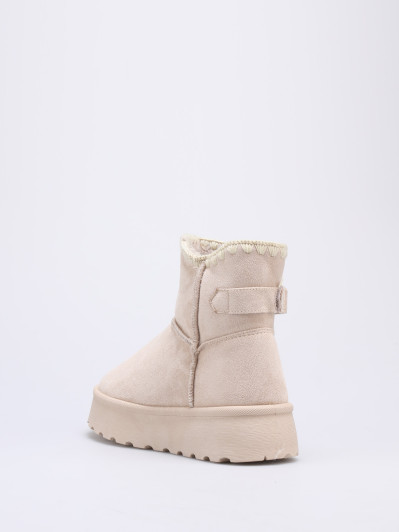 Boots beiges fourrées à bride et plateforme