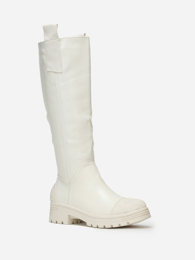 Bottes crèmes crantées avec motifs en relief